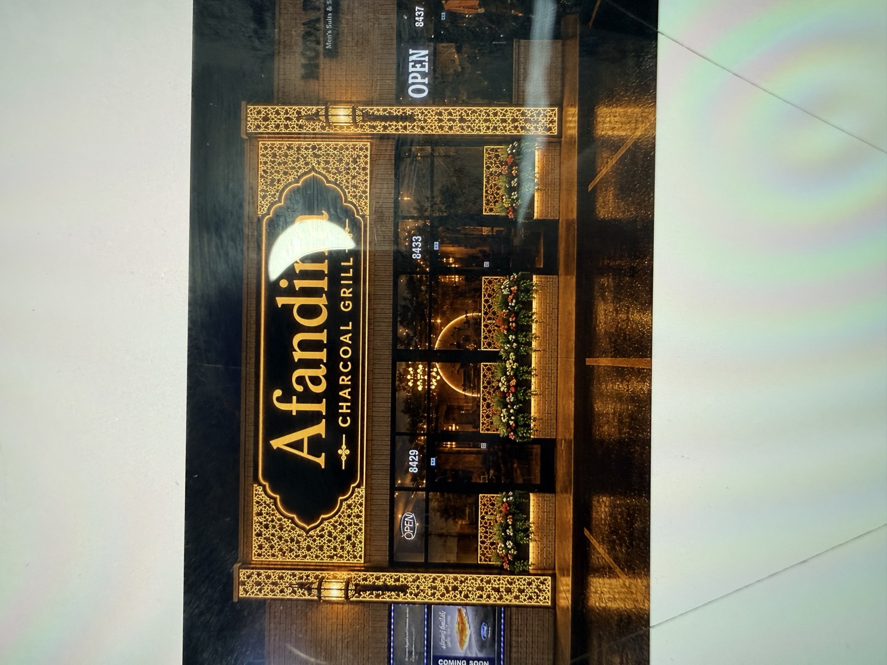 Afandina signage — gold lettering on black