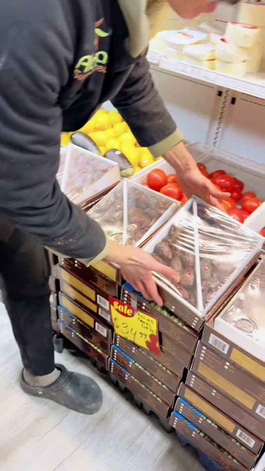 Market specials — fresh stock being shelved at Al Amal